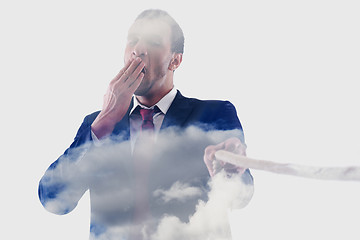 Image showing double exposure of business man with rope isolated on white back