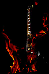 Image showing double exposure  electric guitar and fire