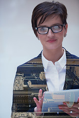 Image showing double exposure of business woman working on tablet computer