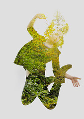 Image showing double exposure of nature and  young woman dancing