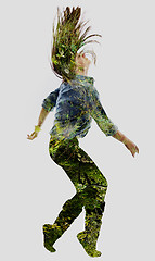 Image showing double exposure of nature and  young woman dancing