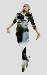 Image showing double exposure of nature and  young woman dancing