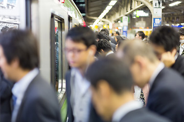 Image showing Business people traveling by Tokyo metro.