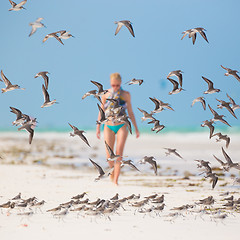 Image showing Woman walking on the beach.