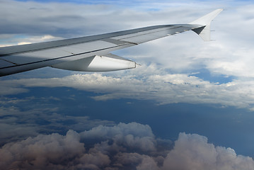 Image showing Airplane wing over cloudscape