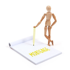 Image showing Wooden mannequin writing - Mortgage