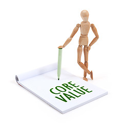 Image showing Wooden mannequin writing - Core value