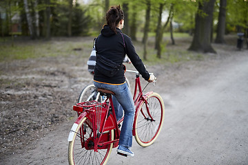 Image showing Woman on the bicycle in the park