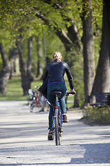 Image showing Woman on the bicycle in park