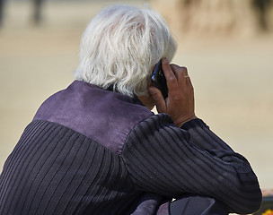 Image showing Senior man speaking on smartphone