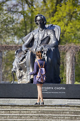 Image showing Young woman standing near Chopin statue