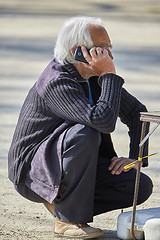 Image showing Senior man speaking on smartphone