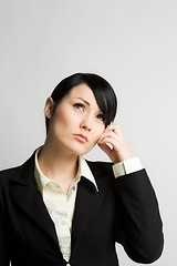 Image showing Thinking businesswoman