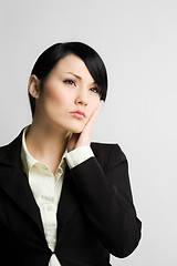 Image showing Daydreaming businesswoman