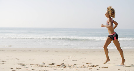 Image showing Woman Running On The Beach