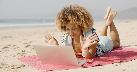 Image showing Woman Using Her Laptop Outdoor