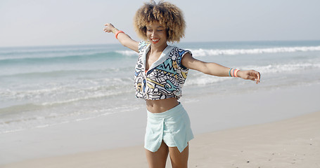 Image showing Girl Jumping With Joy On The Seashore