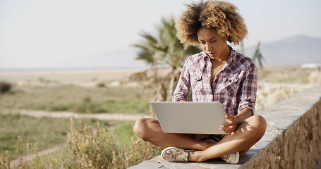 Image showing Girl Working With A Laptop Outdoors