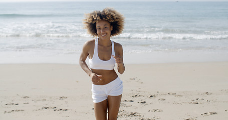 Image showing Woman Jogging On The Beach