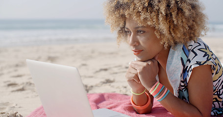 Image showing Girl Working On The Sand Beach