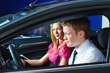 Image showing Young couple sitting in car