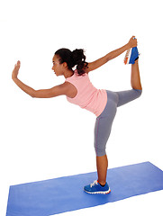 Image showing Beautiful African American woman stretching her body.