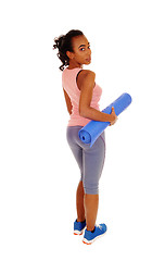 Image showing Lovely african american woman with yoga mat.