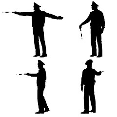 Image showing Set black silhouettes  Police officer  with a rod on white 