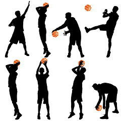 Image showing Set back silhouettes of men playing basketball on a white 