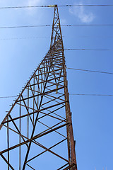 Image showing High voltage power pylons against blue sky