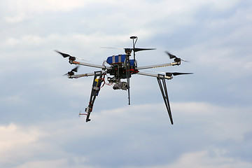 Image showing Flying  drone in the sky with mounted  digital camera