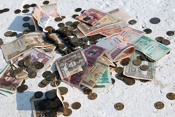 Image showing Pile of money notes and coins of different countries