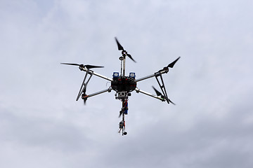 Image showing Flying  drone in the sky with mounted  digital camera