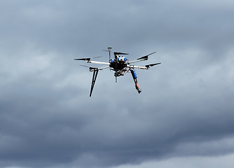 Image showing Flying  drone in the sky with mounted  digital camera