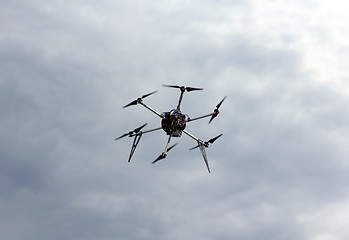 Image showing Flying  drone in the sky with mounted  digital camera