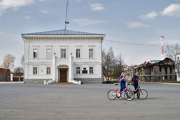 Image showing Cyclists conduct bicycles against administration