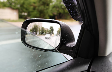 Image showing rear-view mirror in rainy weather