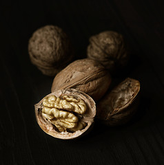 Image showing Walnuts on rustic old wooden table