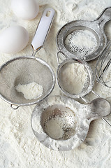 Image showing Kitchen utensils and wheat flour