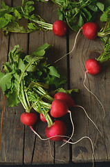 Image showing  fresh radishes on wooden table