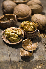 Image showing Walnuts on rustic old wooden table