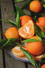 Image showing fresh mandarins with leafs