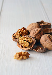 Image showing Walnuts on rustic old wooden table