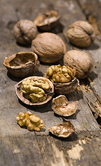 Image showing Walnuts on rustic old wooden table