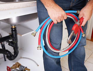 Image showing Plumber on the kitchen.