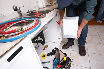 Image showing Plumber on the kitchen.