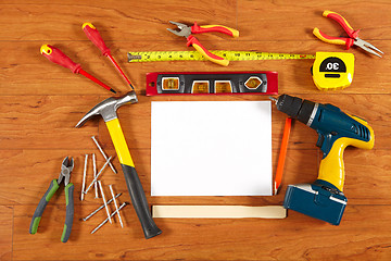 Image showing Construction tools on the wooden floor