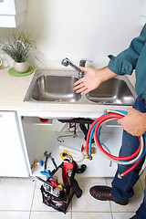Image showing Plumber on the kitchen.