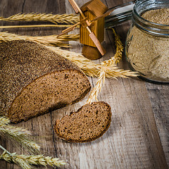 Image showing Black homemade bread and rye cones