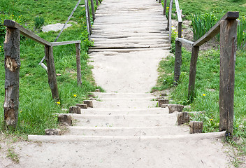 Image showing Wooden bridge on a country road.